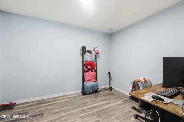 a view of workspace with wooden floor