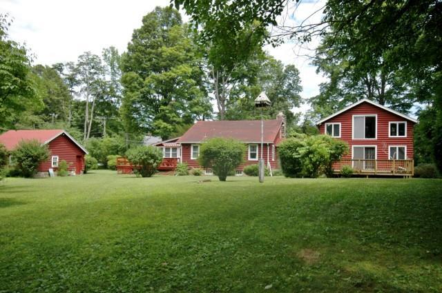 50 Crest Road Ridgefield, CT 06877 - Photo 1 of 1 a front of a house with a garden