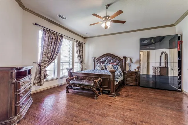 a bedroom with furniture window and wooden floor