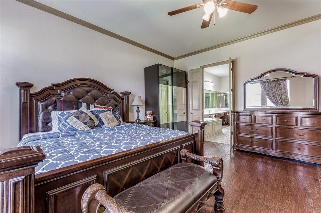 2245 Homestead Lane Plano, TX 75025 - Photo 14 of 25 a bedroom with furniture and wooden floor