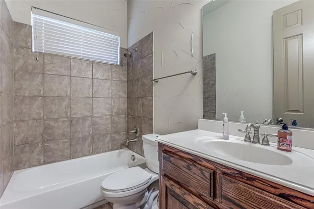 a bathroom with a sink a toilet and a bathtub