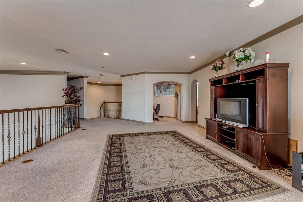 2245 Homestead Lane Plano, TX 75025 - Photo 21 of 25 a living room with furniture and a flat screen tv