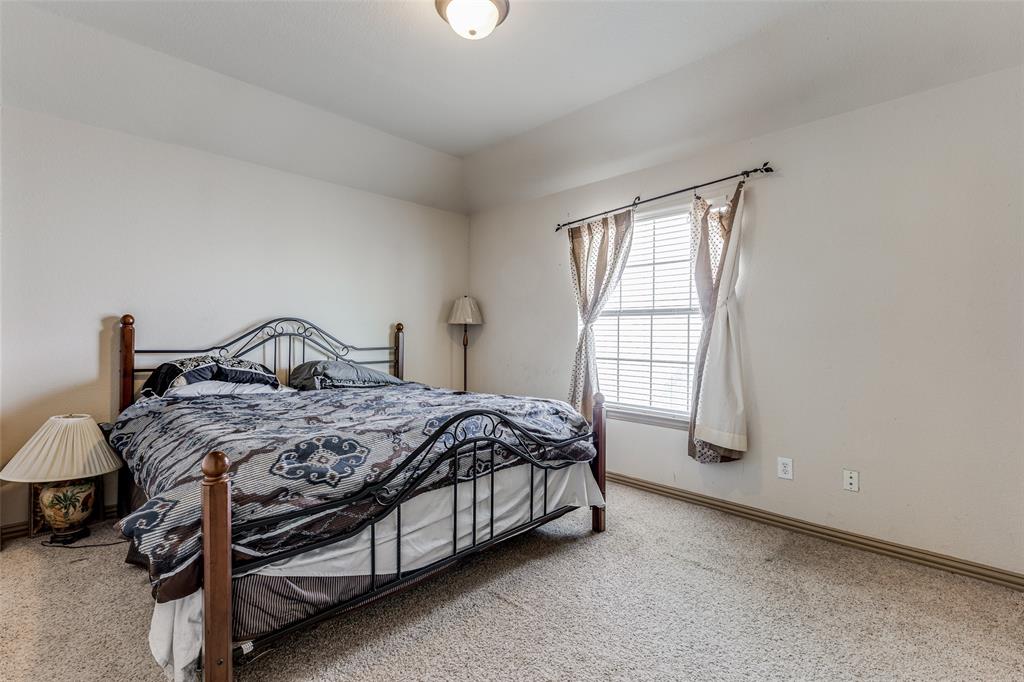 2245 Homestead Lane Plano, TX 75025 - Photo 22 of 25 a bedroom with a bed and a window