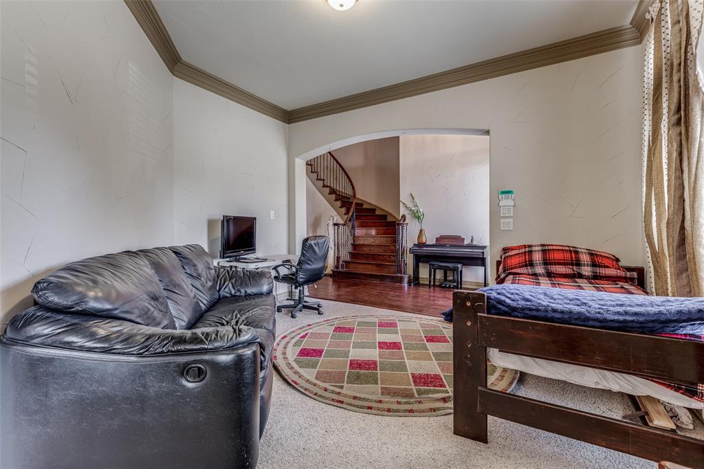 2245 Homestead Lane Plano, TX 75025 - Photo 5 of 25 a living room with furniture and a wooden floor