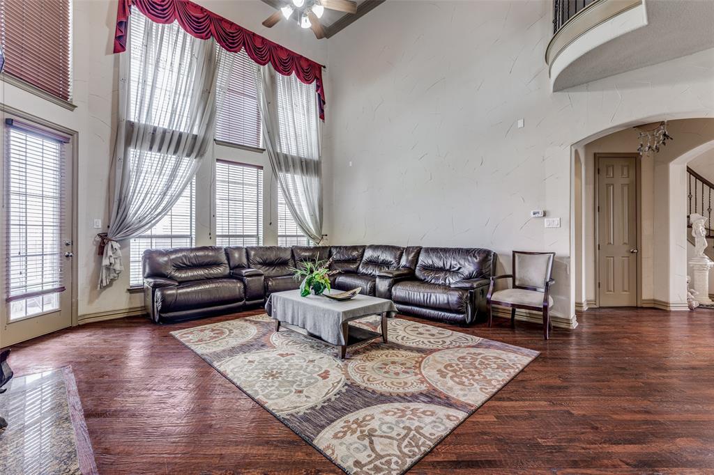 2245 Homestead Lane Plano, TX 75025 - Photo 6 of 25 a living room with furniture and a large window