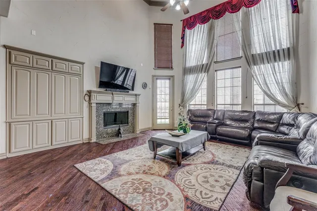 a living room with furniture fireplace and window