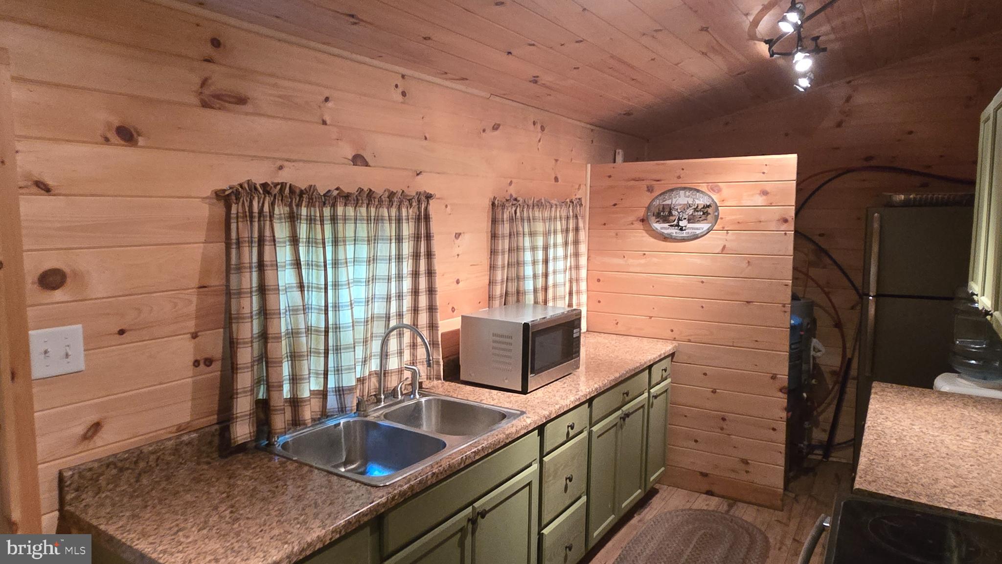 212 Thickhead Mountain Road Centre Hall, PA 16828 - Photo 18 of 28 Cozy kitchen with rustic charm and warmth.