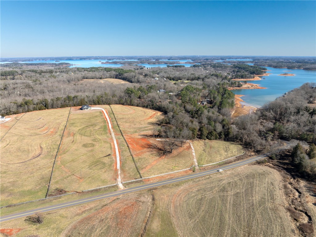 367 Dobbins Road Townville, SC 29689 - Photo 3 of 16 Expansive landscape featuring a distant lake, offering serene natural beauty.