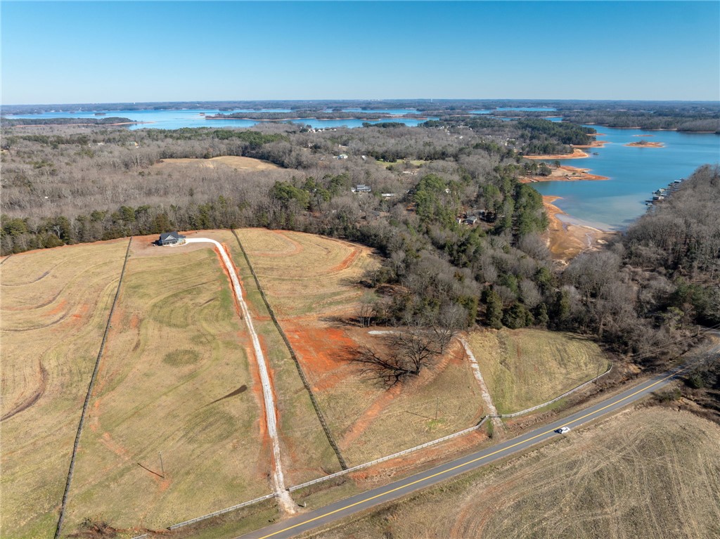 367 Dobbins Road Townville, SC 29689 - Photo 5 of 16 Perched on expansive acreage, this property offers serene lake views and a private driveway.