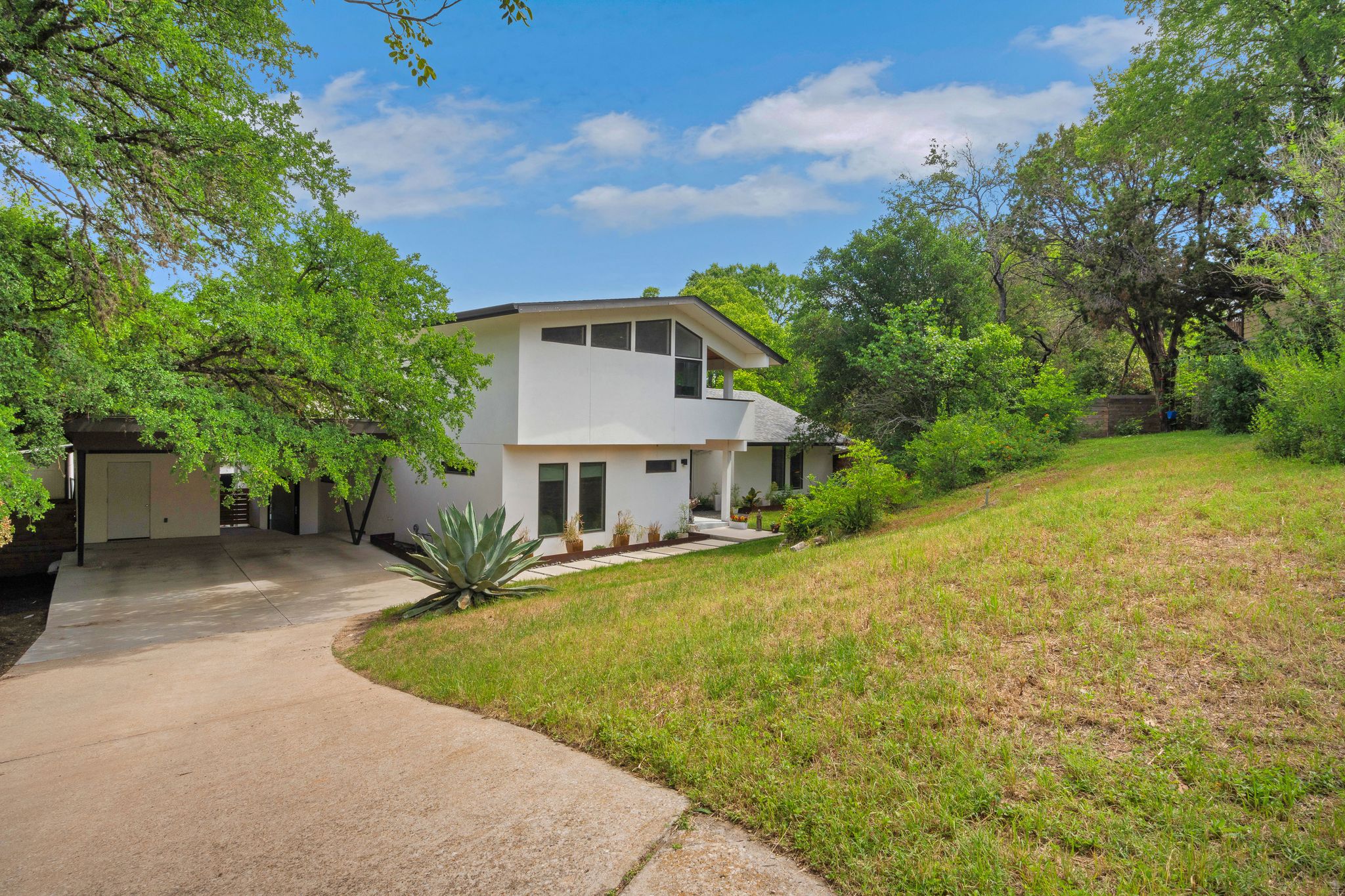 a front view of a house with yard