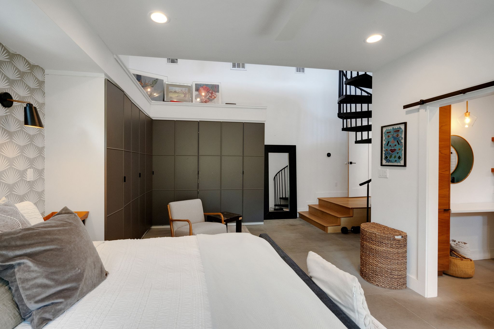 2502 Side Cove Austin, TX 78704 - Photo 14 of 35 a bedroom with a bed and a large mirror