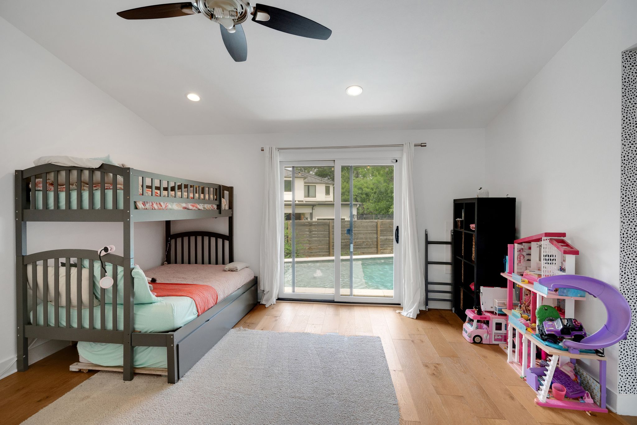 2502 Side Cove Austin, TX 78704 - Photo 20 of 30 a bedroom with furniture and a book shelf