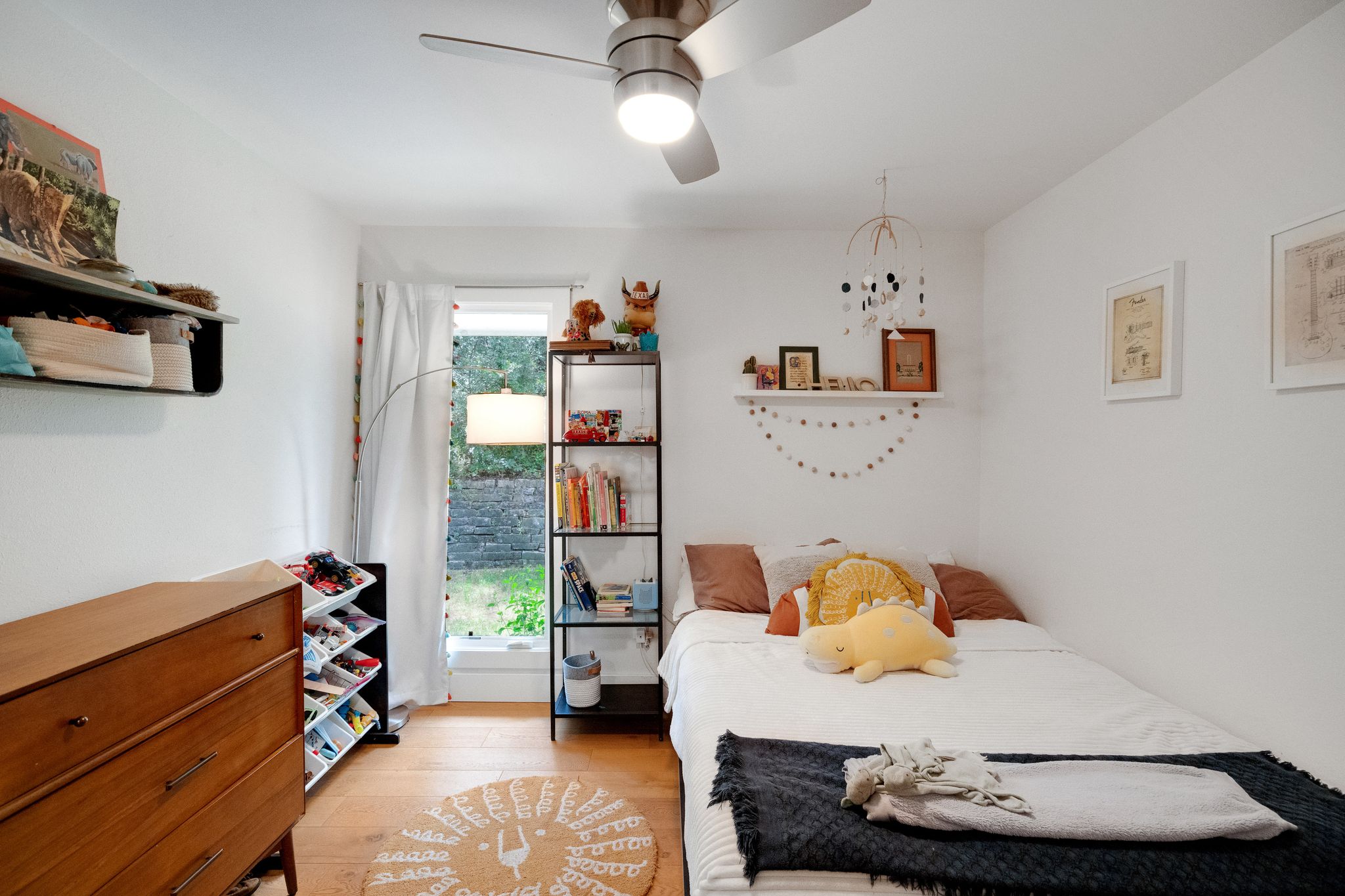 2502 Side Cove Austin, TX 78704 - Photo 24 of 30 a bedroom with furniture and a wooden floor