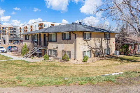 a view of a house with large windows
