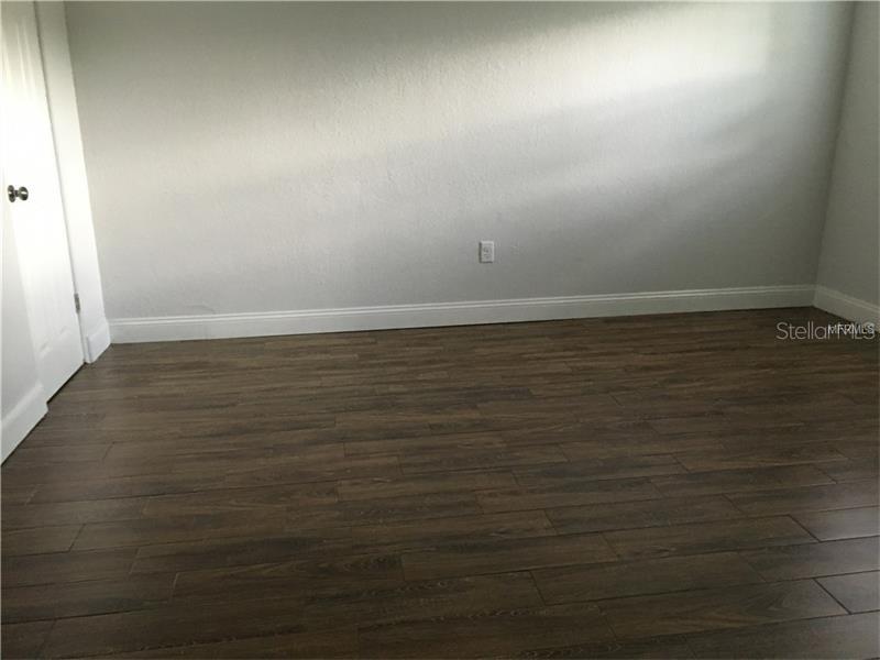 508 Varsity Street Winter Garden, FL 34787 - Photo 8 of 10 a view of room with wooden floor