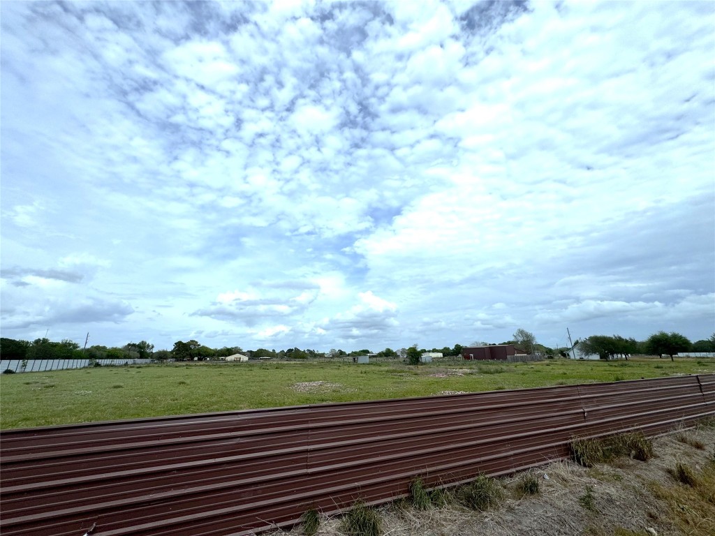 4501 Baker Road Needville, TX 77461 - Photo 2 of 8 a view of a yard with wooden fence