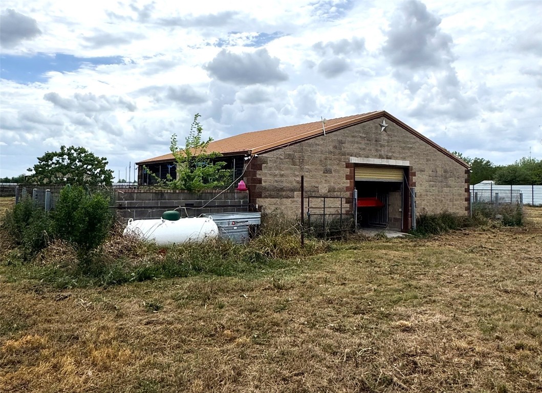 4501 Baker Road Needville, TX 77461 - Photo 3 of 8 a backyard of a house with table and chairs