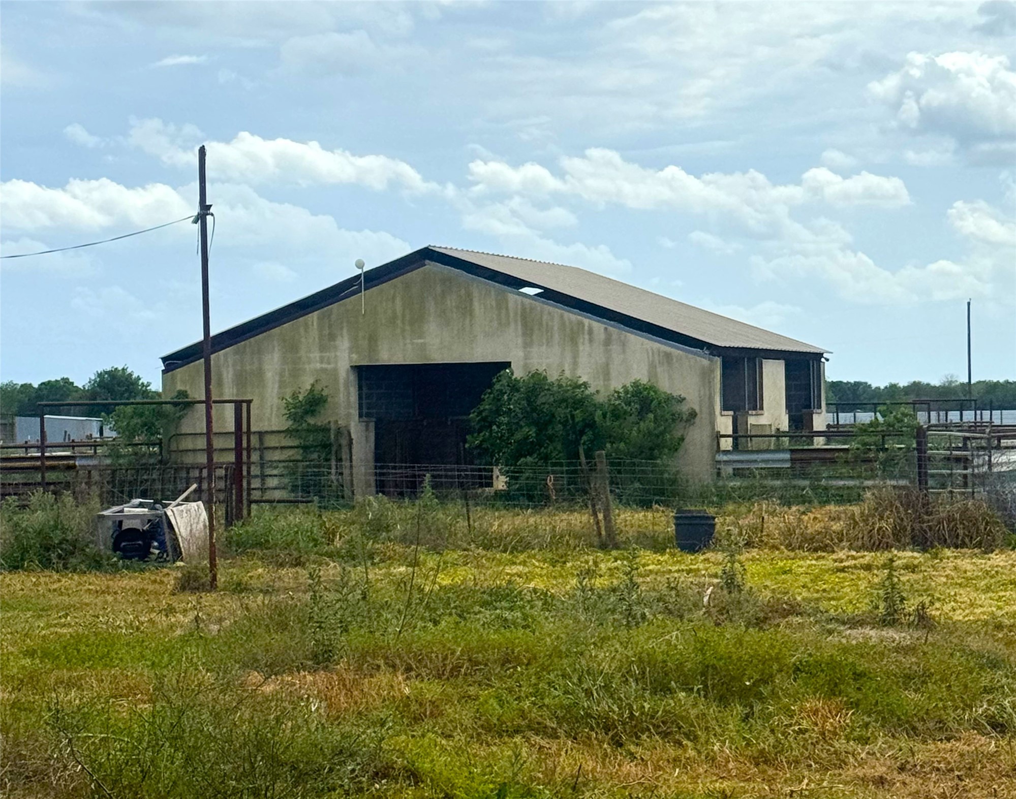 4501 Baker Road Needville, TX 77461 - Photo 4 of 8 a backyard of a house with swimming pool table and chairs