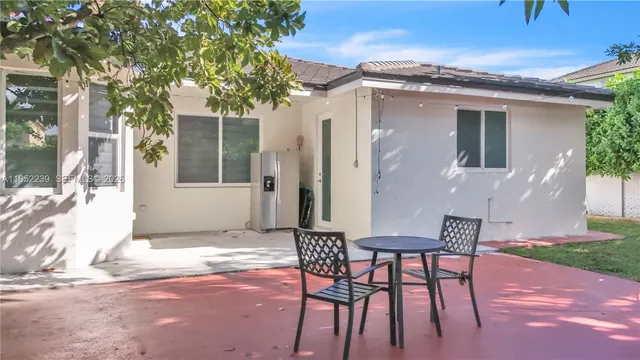 a kitchen with sink cabinets and window