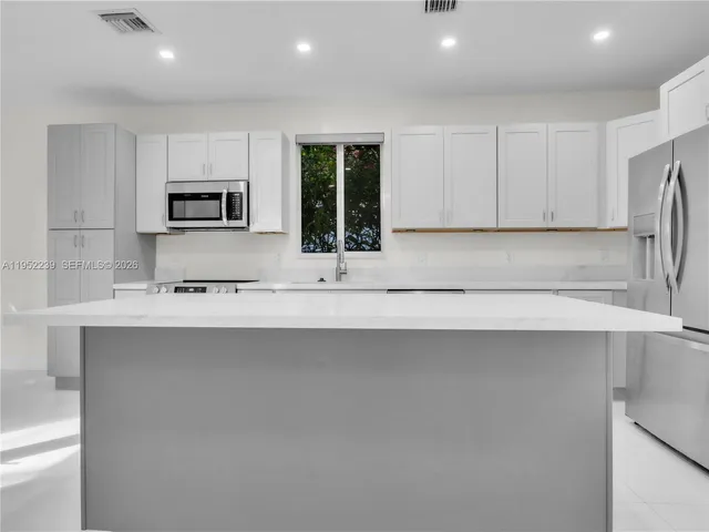a bathroom with a shower and a sink