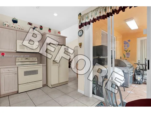 a view of living room filled with furniture and wooden floor