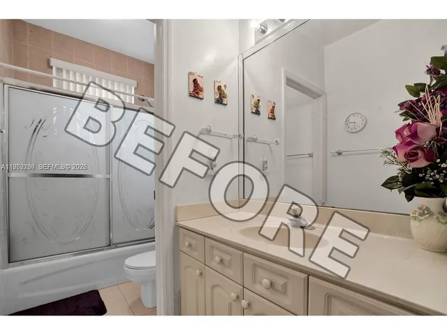a view of a livingroom with furniture and a flat screen tv