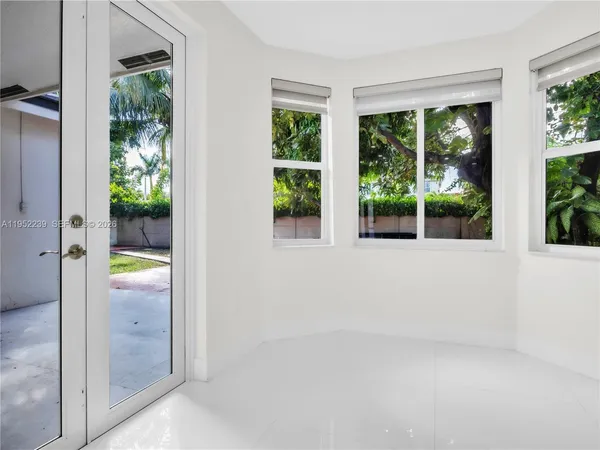 an empty room and windows