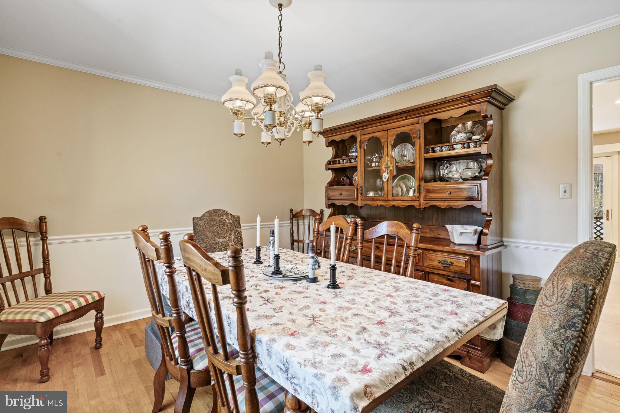 1400 Mountain Road Haymarket, VA 20169 - Photo 16 of 59 Dining Room with crown molding and chair railing.