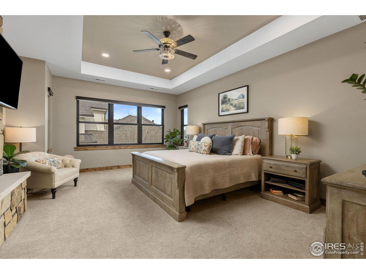 2734 Southwind Road Berthoud, CO 80513 - Photo 28 of 50 Primary Suite is Pure Luxury with See-thru Fireplace, Coffee Bar, Oversized Bathroom, and Walk-In Closet