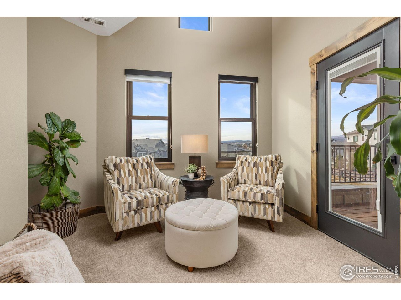 2734 Southwind Road Berthoud, CO 80513 - Photo 31 of 50 Primary Suite Private Sitting Area with Deck Access