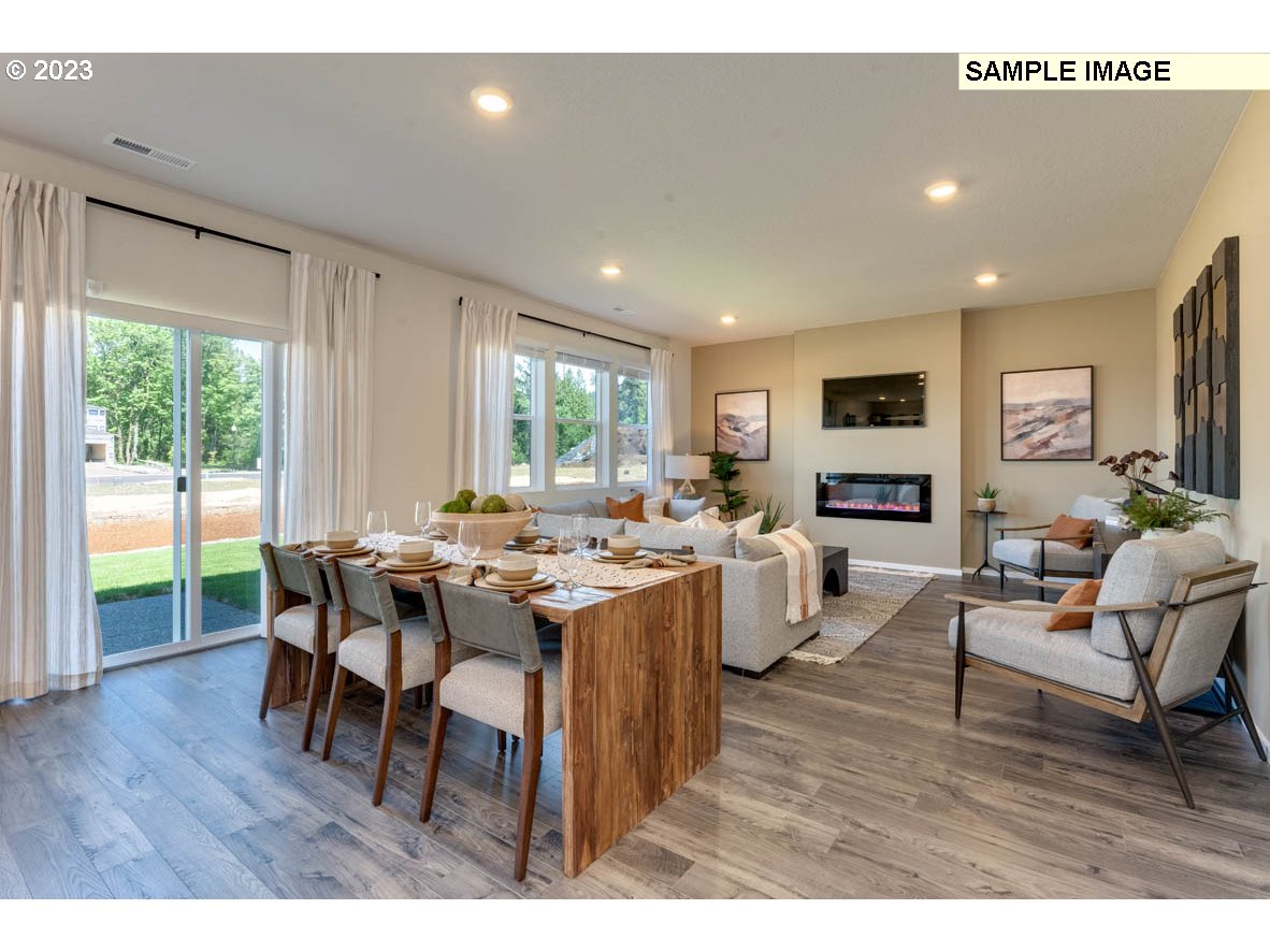 141 Cedar Springs Loop North Kalama, WA 98625 - Photo 14 of 31 a view of a dining room with furniture window and wooden floor