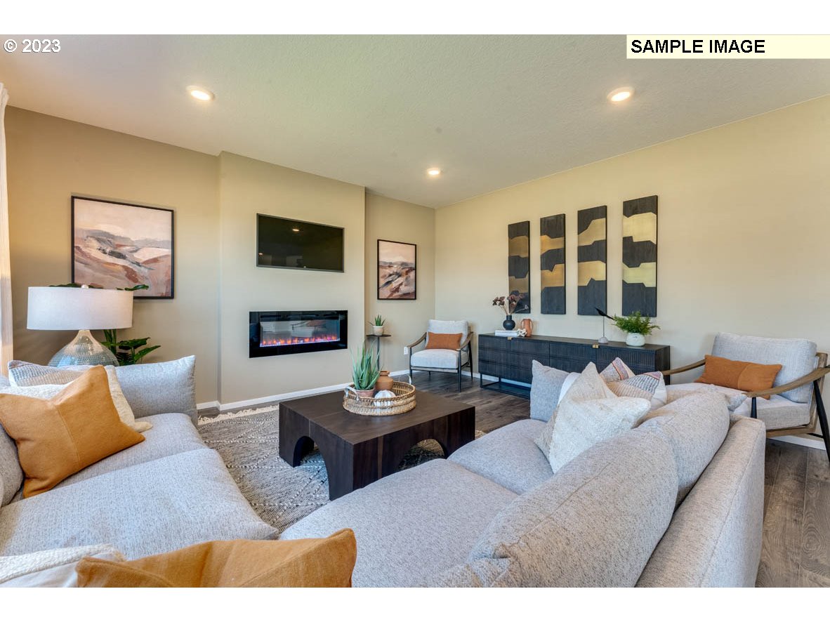141 Cedar Springs Loop North Kalama, WA 98625 - Photo 16 of 31 a living room with furniture and a flat screen tv
