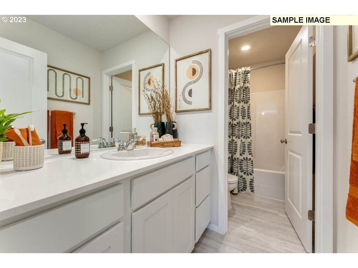 141 Cedar Springs Loop North Kalama, WA 98625 - Photo 25 of 31 a bathroom with a sink and a mirror