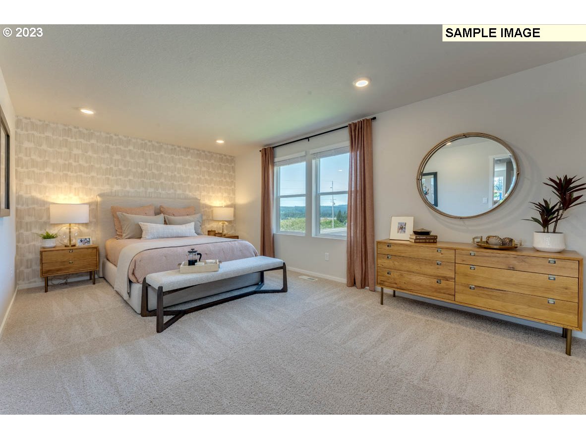 141 Cedar Springs Loop North Kalama, WA 98625 - Photo 26 of 31 a bed room with a bed and a dresser