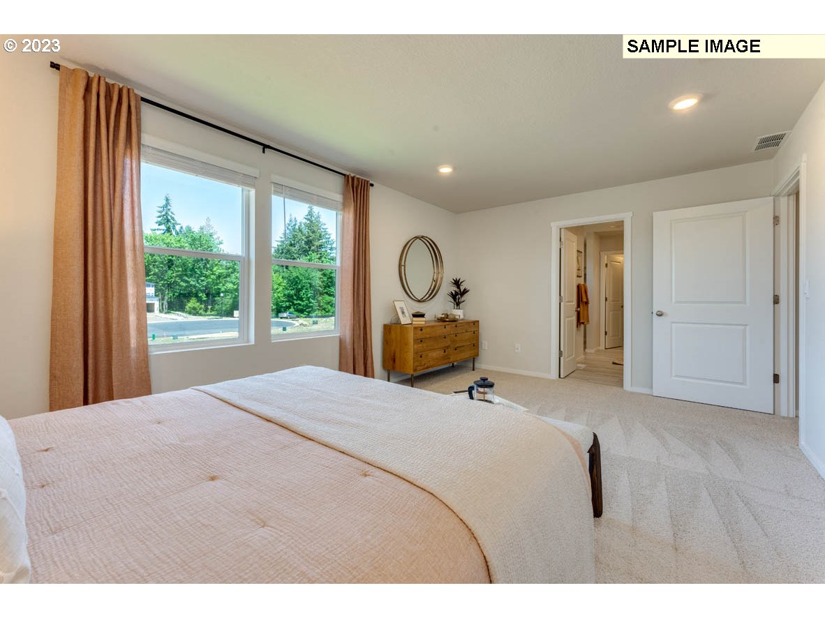 141 Cedar Springs Loop North Kalama, WA 98625 - Photo 27 of 31 a bedroom with a bed and a large window