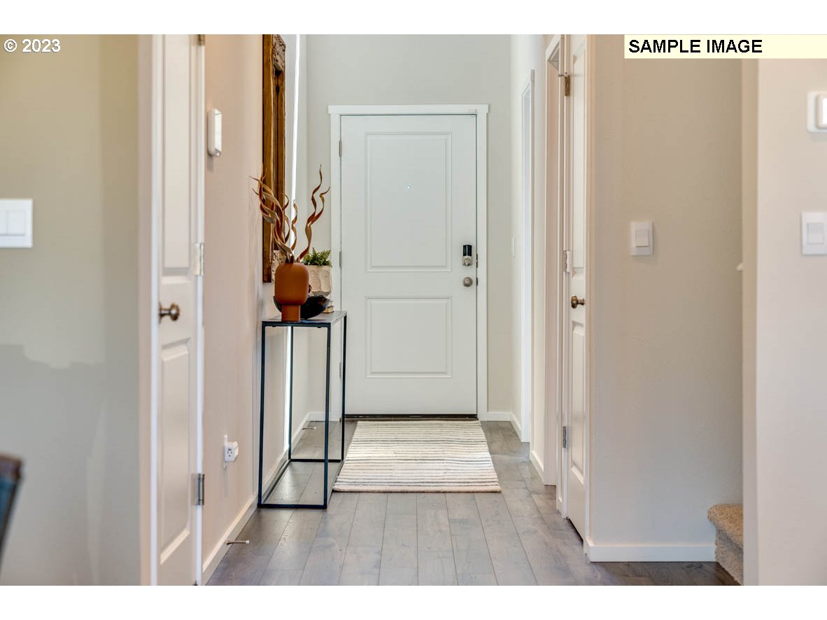 141 Cedar Springs Loop North Kalama, WA 98625 - Photo 3 of 31 a view of a hallway with wooden floor
