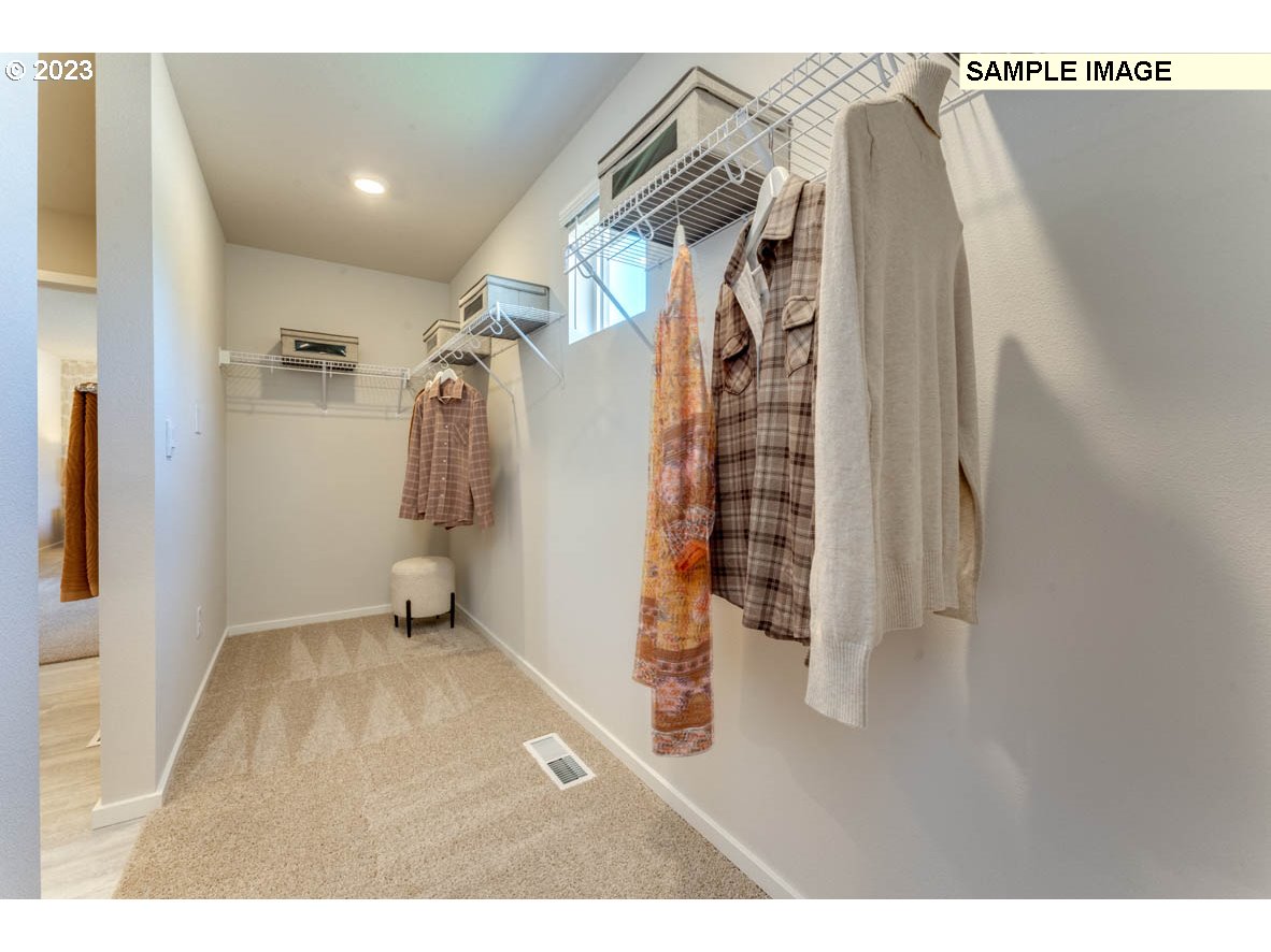 141 Cedar Springs Loop North Kalama, WA 98625 - Photo 31 of 31 a view of walk in closet with clothes and shoes