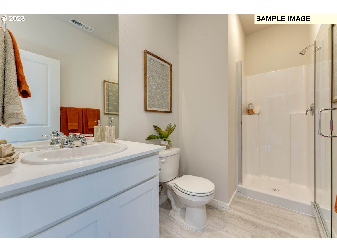 141 Cedar Springs Loop North Kalama, WA 98625 - Photo 5 of 31 a bathroom with a sink and a mirror
