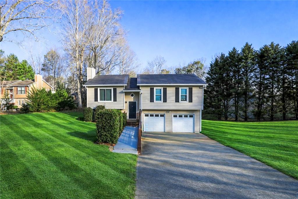a front view of a house with a yard
