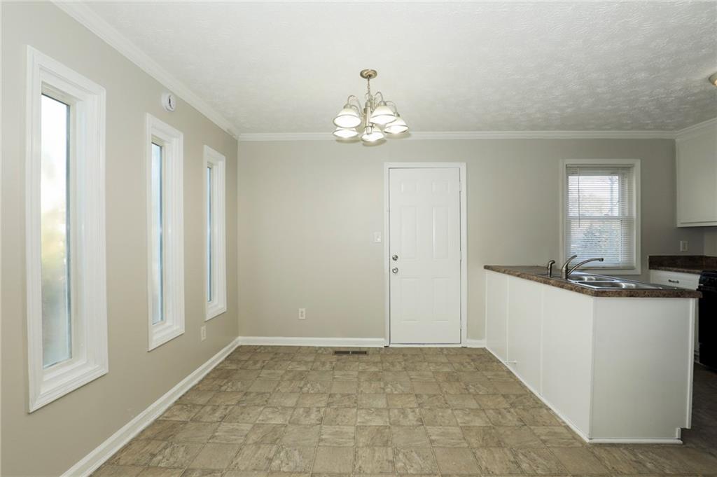 206 Emily Drive Dallas, GA 30157 - Photo 12 of 17 a view of a kitchen with a stove cabinets