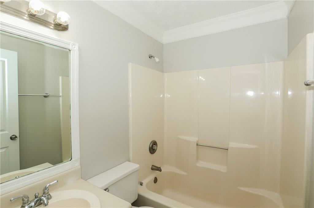 206 Emily Drive Dallas, GA 30157 - Photo 15 of 17 a bathroom with a bathtub and a shower