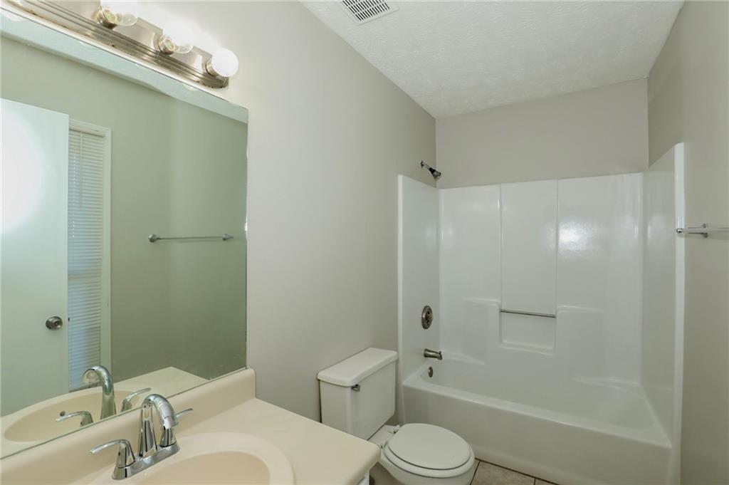 206 Emily Drive Dallas, GA 30157 - Photo 16 of 17 a bathroom with a sink toilet and shower