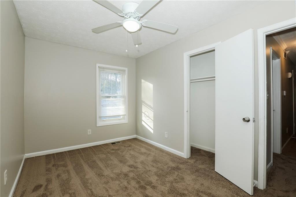 206 Emily Drive Dallas, GA 30157 - Photo 8 of 17 a view of an empty room with a window
