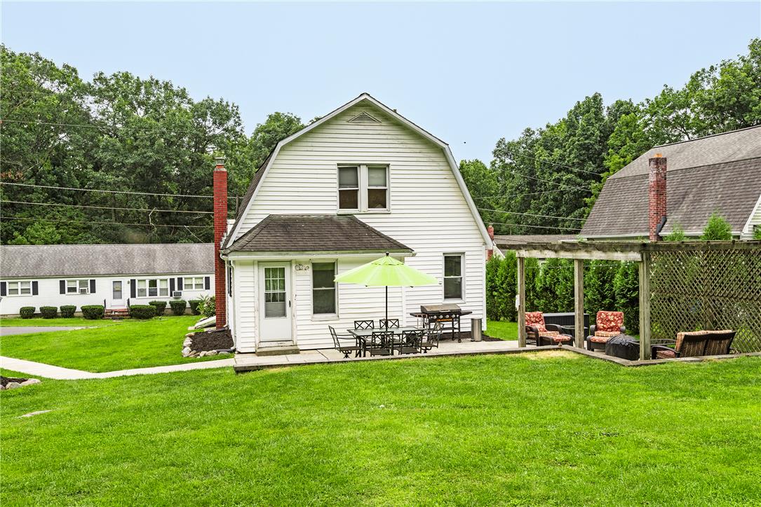 280 Oak Road Bangor, PA 18013 - Photo 43 of 52 An inviting backyard patio sits adjacent to the lawn, perfect for outdoor dining and entertaining.