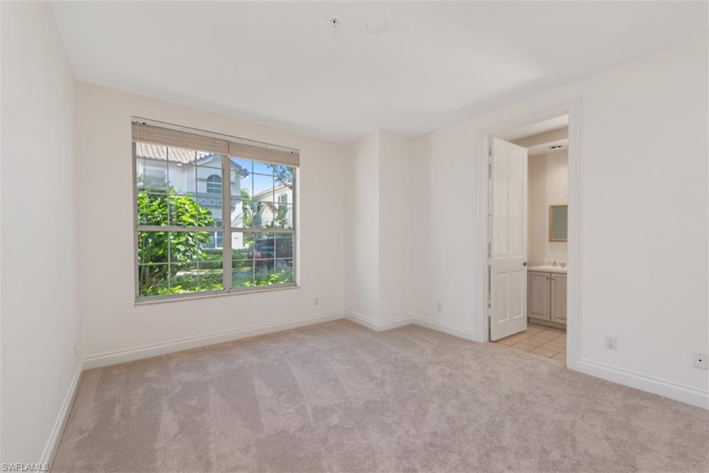 133 Colonade Circle Naples, FL 34103 - Photo 11 of 24 an empty room with windows