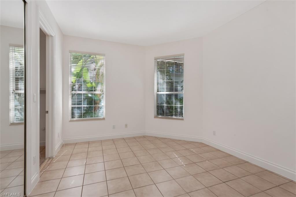 133 Colonade Circle Naples, FL 34103 - Photo 13 of 24 an empty room with windows