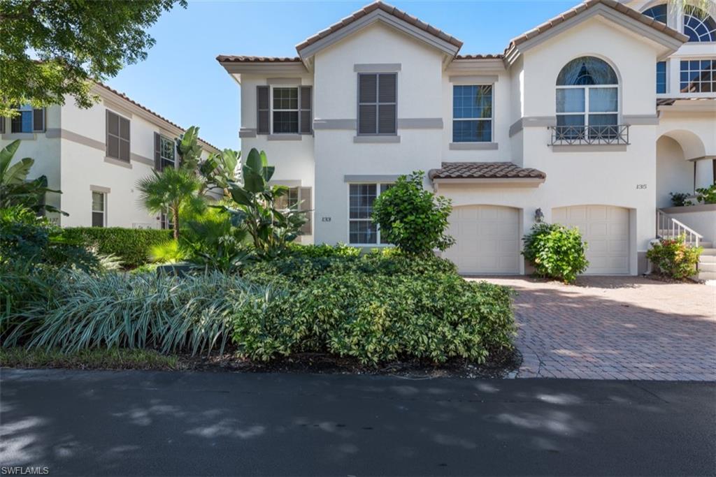 133 Colonade Circle Naples, FL 34103 - Photo 16 of 24 a front view of a house with garden