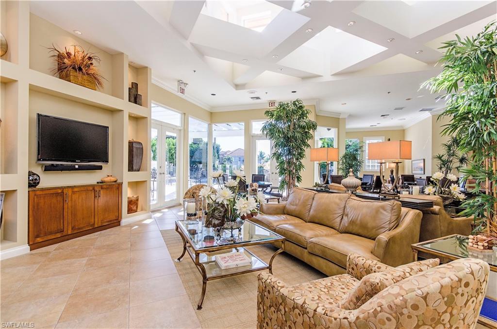 133 Colonade Circle Naples, FL 34103 - Photo 17 of 24 a living room with furniture and a flat screen tv