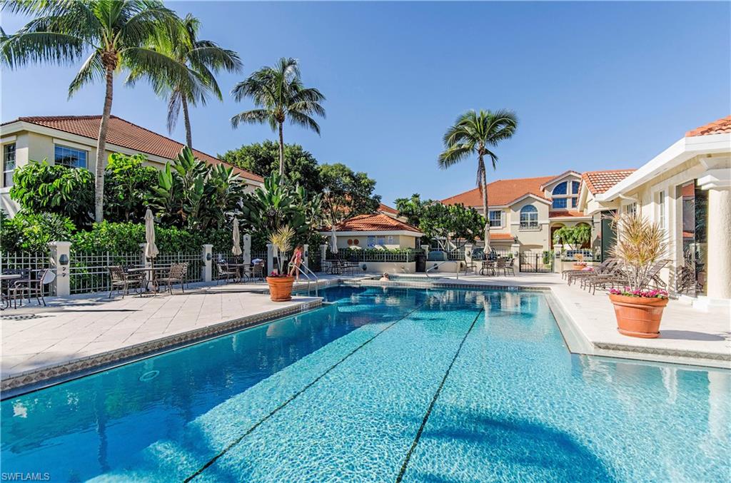 133 Colonade Circle Naples, FL 34103 - Photo 19 of 24 a view of a backyard with swimming pool