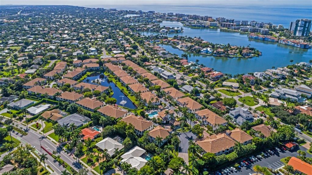 133 Colonade Circle Naples, FL 34103 - Photo 21 of 24 an aerial view of residential house with outdoor space and lake view